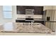 Kitchen features granite countertops, stainless steel appliances, and modern finishes at 1246 E Thomas Dr, Casa Grande, AZ 85122