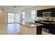 Eat-in kitchen with granite countertops, stainless appliances, and sliding glass doors at 1246 E Thomas Dr, Casa Grande, AZ 85122