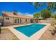 Aerial view of the backyard pool, patio and desert landscaping at 12529 N 83Rd Ln, Peoria, AZ 85381