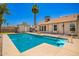 Sparkling backyard pool with storage shed, desert landscaping, and stairs leading to the pool at 12529 N 83Rd Ln, Peoria, AZ 85381