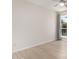 Bright bedroom featuring wood-look floors, a ceiling fan and window at 12529 N 83Rd Ln, Peoria, AZ 85381