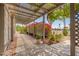 Inviting front porch with seating area, stylish rug, and decorative lattice at 12529 N 83Rd Ln, Peoria, AZ 85381