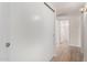 Hallway with a closet and views into the bathroom and other rooms at 12529 N 83Rd Ln, Peoria, AZ 85381
