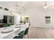 Bright, eat-in kitchen with sleek countertops, modern lighting, and views of the backyard at 12529 N 83Rd Ln, Peoria, AZ 85381