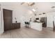 Eat-in kitchen featuring white cabinets, stainless steel appliances, and pendant lighting at 12529 N 83Rd Ln, Peoria, AZ 85381