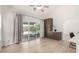 Bright living room with sliding glass doors to the backyard and a view of the pool at 12529 N 83Rd Ln, Peoria, AZ 85381