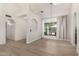 Open-concept living room with a large window providing lots of natural light and views of the exterior at 12529 N 83Rd Ln, Peoria, AZ 85381