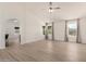 Spacious living room featuring lots of natural light and stylish, light-colored flooring at 12529 N 83Rd Ln, Peoria, AZ 85381
