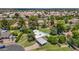 An aerial view highlights the lush landscaping, sparkling pool, and covered parking of the home at 1298 E Buffalo St, Chandler, AZ 85225
