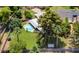 Aerial view of the property with mature trees, green grass and a refreshing swimming pool for outdoor relaxation at 1298 E Buffalo St, Chandler, AZ 85225