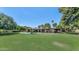 Expansive back exterior featuring a large lawn and sparkling pool at 1298 E Buffalo St, Chandler, AZ 85225