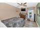Bedroom with hardwood floors, a dresser, and window offering plenty of natural light at 1298 E Buffalo St, Chandler, AZ 85225
