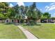 Charming single-story home with lush landscaping and mature trees at 1298 E Buffalo St, Chandler, AZ 85225