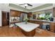 Cozy kitchen featuring wood cabinets, a center island, and views of the yard at 1298 E Buffalo St, Chandler, AZ 85225