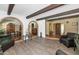 Large living room featuring brick archways and wood-like flooring at 1298 E Buffalo St, Chandler, AZ 85225