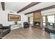 Living room with fireplace, wood beams, and lots of natural light at 1298 E Buffalo St, Chandler, AZ 85225