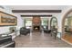 Living room with fireplace, beamed ceilings, and brick archway at 1298 E Buffalo St, Chandler, AZ 85225
