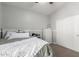A cozy bedroom features a neutral color palette, a plush bed, carpet and ample natural light at 13005 W Vista Paseo Dr, Litchfield Park, AZ 85340