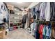 Organized walk-in closet with shelving, storage space, and ample hanging rods at 13005 W Vista Paseo Dr, Litchfield Park, AZ 85340