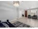 Cozy living room with tile floors, bright windows, and stylish contemporary furnishings at 13005 W Vista Paseo Dr, Litchfield Park, AZ 85340