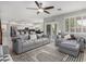 Bright open-concept living room with views to the kitchen and backyard at 13005 W Vista Paseo Dr, Litchfield Park, AZ 85340