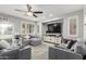 Inviting living room featuring a modern ceiling fan and recessed lighting at 13005 W Vista Paseo Dr, Litchfield Park, AZ 85340