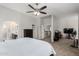 Bright primary bedroom showcasing an ensuite bathroom, and carpet flooring throughout at 13005 W Vista Paseo Dr, Litchfield Park, AZ 85340