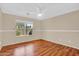 Bedroom featuring wood laminate floors, neutral walls and natural lighting at 1314 S Bridgegate Dr, Gilbert, AZ 85296