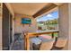 Covered patio featuring TV and access to backyard for entertainment, as well as a sliding glass door into the home at 1314 S Bridgegate Dr, Gilbert, AZ 85296