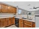 Well lit kitchen featuring granite counters, wooden cabinets and stainless steel appliances at 1314 S Bridgegate Dr, Gilbert, AZ 85296