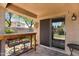 Covered patio with access to home via sliding glass door, providing a great spot for entertaining or relaxing at 1314 S Bridgegate Dr, Gilbert, AZ 85296