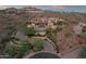 Luxury home with circular driveway, water features, and lush desert landscaping at 15536 E Heavenly Vista Trl, Fountain Hills, AZ 85268