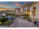 Luxurious backyard featuring a pool, spa, covered patio, and ornate architectural accents at 15536 E Heavenly Vista Trl, Fountain Hills, AZ 85268