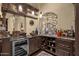 Stylish bar area with wine storage, granite countertop, and decorative details at 15536 E Heavenly Vista Trl, Fountain Hills, AZ 85268