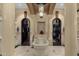 Elegant bathroom with freestanding tub, dual walk-in closets, large tile flooring, and detailed pillars at 15536 E Heavenly Vista Trl, Fountain Hills, AZ 85268
