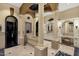Luxurious primary bathroom featuring a soaking tub, white cabinetry, and sophisticated architectural details at 15536 E Heavenly Vista Trl, Fountain Hills, AZ 85268