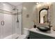 Bathroom featuring a glass walk-in shower, tile surround, and a decorative mirror and sink at 15536 E Heavenly Vista Trl, Fountain Hills, AZ 85268