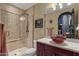 Updated bathroom featuring a glass shower, vessel sink, and cherry wood vanity at 15536 E Heavenly Vista Trl, Fountain Hills, AZ 85268