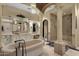 Bright bathroom with a freestanding tub, columns, vanity with sink, and a glass shower room at 15536 E Heavenly Vista Trl, Fountain Hills, AZ 85268
