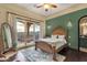 Bedroom features a bed, balcony access, dark hardwood floors, and picturesque mountain views at 15536 E Heavenly Vista Trl, Fountain Hills, AZ 85268