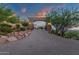 Gated stone archway entrance with a brick driveway leading to a luxurious estate at 15536 E Heavenly Vista Trl, Fountain Hills, AZ 85268