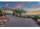 Brick driveway with stone archway entrance, showcasing desert views at sunset at 15536 E Heavenly Vista Trl, Fountain Hills, AZ 85268
