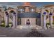 An inviting estate entrance with columns and a decorative tile design leading to the main house at 15536 E Heavenly Vista Trl, Fountain Hills, AZ 85268
