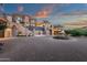 Grand estate with a circular driveway, fountain, and elegant architectural details at 15536 E Heavenly Vista Trl, Fountain Hills, AZ 85268