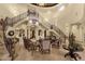 Elegant foyer with a grand staircase, refined furnishings, and sophisticated decor at 15536 E Heavenly Vista Trl, Fountain Hills, AZ 85268