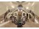 Expansive foyer with soaring ceilings, elegant staircase, and luxury seating area at 15536 E Heavenly Vista Trl, Fountain Hills, AZ 85268