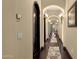 Elegant hallway with arched doorways, hardwood floors, and stylish lighting fixtures at 15536 E Heavenly Vista Trl, Fountain Hills, AZ 85268