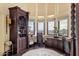 Spacious home office with custom built-ins, a work desk, and large windows offering views at 15536 E Heavenly Vista Trl, Fountain Hills, AZ 85268