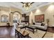 Elegant living room with dark hardwood floors, high ceilings, stylish decor, and bar area at 15536 E Heavenly Vista Trl, Fountain Hills, AZ 85268