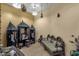 Cozy living room featuring unique decor, seating, and tile floors at 15536 E Heavenly Vista Trl, Fountain Hills, AZ 85268